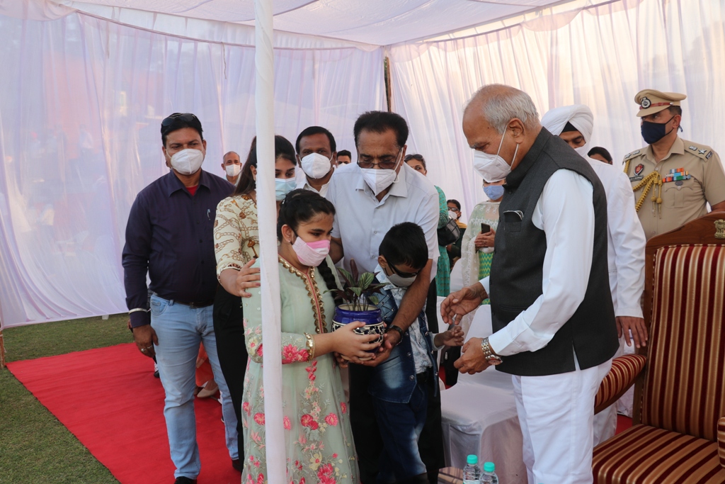 Visually challenged students of NAB welcoming the Hon’ble Governor of Punjab by presenting him the plant